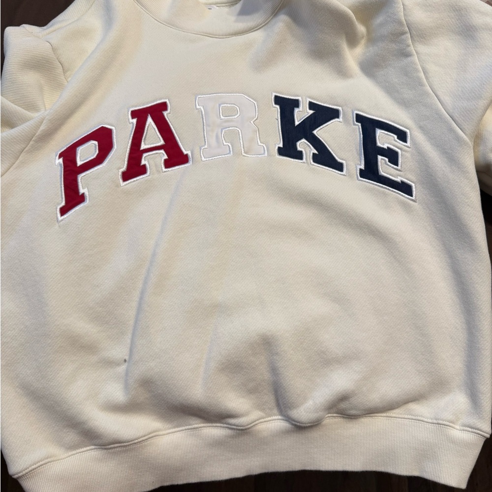 Women's Cream Sweatshirt with Red, White, and Blue Lettering